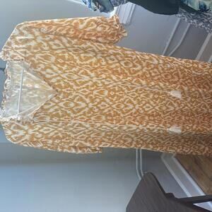 Bohemian-Inspired Orange Maxi Dress with Decorative Tassels